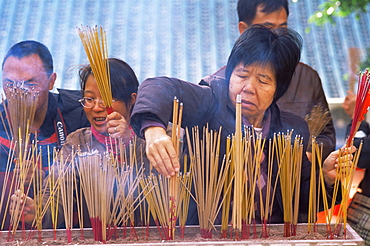 People praying at Wong Tai Sin Temple, Hong Kong, China, Asia