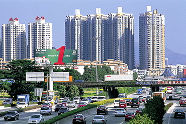 Modern highway with traffic and high rise apartments, Shenzhen, Guangdong Province, China, Asia