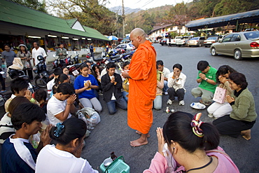 Monksreceiving offerings of food, Chiang Mai, Thailand, Southeast Asia, Asia