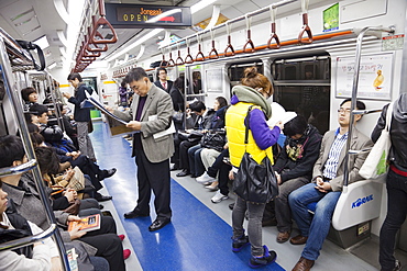 Commuters in subway carriage, Seoul, South Korea, Korea, Asia