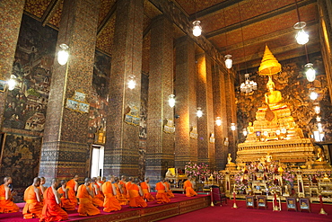 Buddhist monks praying in the main chapel, Wat Pho, Bangkok, Thailand, Southeast Asia, Asia