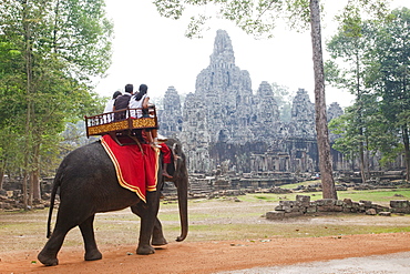 Tourists on elephant, Bayon Temple, Angkor Thom, Angkor, UNESCO World Heritage Site, Siem Reap, Cambodia, Indochina, Southeast Asia, Asia