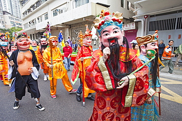 Parade participants dressed in Lucky God costumes, Tai Kok Tsui Temple Fair, Hong Kong, China, Asia