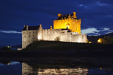 Eilean Donan Castle illuminated at night, Highlands, Scotland, United Kingdom, Europe