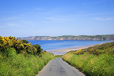 Empty road and beach, Pembrokeshire Coast National Park, Pembrokeshire, Wales, United Kingdom, Europe