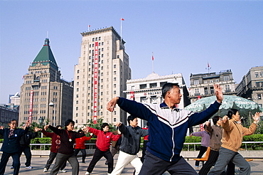 People doing Tai-chi on the Bund, Shanghai, China, Asia