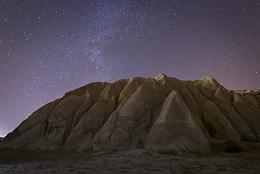 Night time in the Rose Valley showing the rock formations and desert landscape light painted with torches, Cappadocia, Anatolia, Turkey, Asia Minor, Eurasia