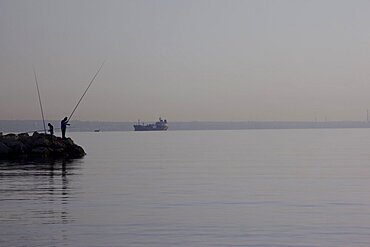 Two fishermen at work