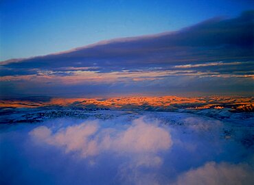 Aerial view of the Judea desert over clouds after a storm, Israel