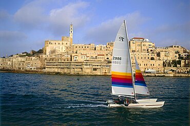 Aerial photograph of a catamaran and the old city of Jaffa, Israel