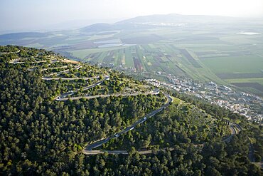 Abstract view of the road to the summit of mount Tavor in the Lower Galilee at sunrise, Israel