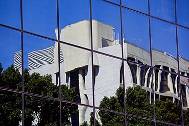 Abstract photograph of a building's reflection on the windows of a modern one, Israel