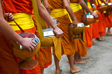 Procession of Buddhist monks collecting alms and rice at dawn, Luang Prabang, Laos, Indochina, Southeast Asia, Asia