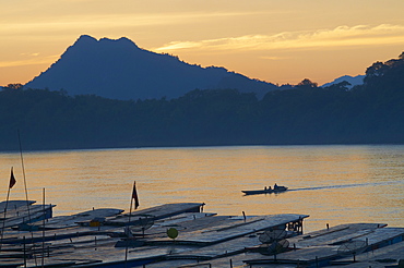 Tourist boats at sunset on the Mekong River, Luang Prabang, Laos, Indochina, Southeast Asia, Asia