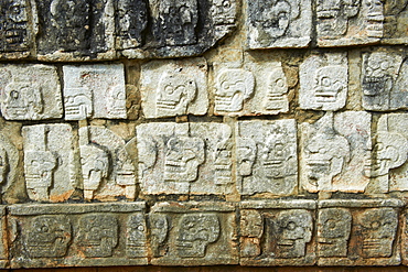 Detail of stone relief of skulls, ancient Mayan ruins, Chichten Itza, UNESCO World Heritage Site, Yucatan, Mexico, North America