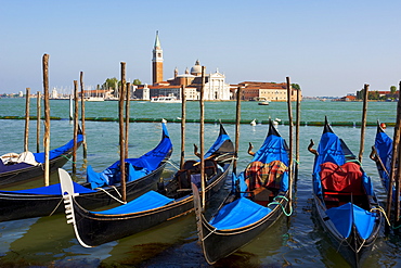 Gondolas and the island of San Giorgio Maggiore, Venice, UNESCO World Heritage Site, Veneto, Italy, Europe