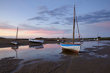 Sunset at low tide at Burnham Overy Staithe, Norfolk, England, United Kingdom, Europe