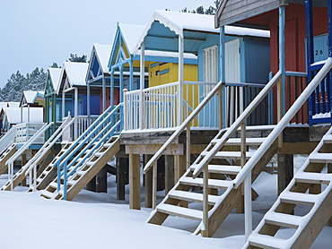 Beach huts in the snow at Wells next the Sea, Norfolk, England