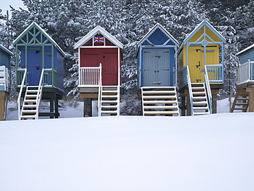 Beach huts in the snow at Wells next the Sea, Norfolk, England