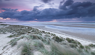 Dramatic conditions at twilight at Holkham Bay, Norfolk, England, United Kingdom, Europe