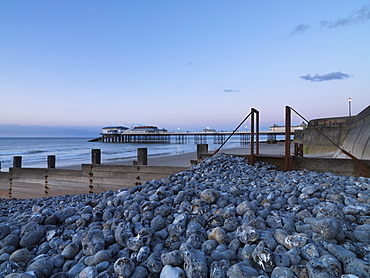 A twilight view of the beach and pier at Cromer, Norfolk, England, United Kingdom, Europe