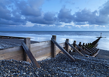 Sea defenses on the pebbly beach at Sheringham, Norfolk, England, United Kingdom, Europe