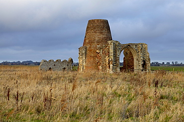 The remains of the 14th century St. Benet's Abbey and the windmill built within its walls near Ludham, Norfolk, England, United Kingdom, Europe