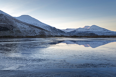 A view of the mountains of Cranstackie and Foinaven from a small lochan near Carbreck, Sutherland, Scotland, United Kingdom, Europe