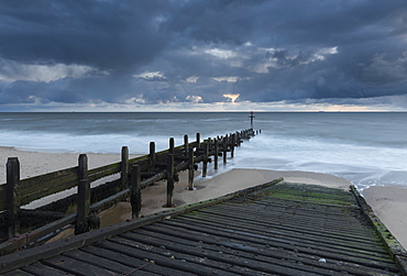 A slipway and groynes on the beach at Walcott, Norfolk, England, United Kingdom, Europe