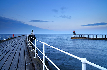 A calm spring evening on the pier at Whitby, North Yorkshire, Yorkshire, England, United Kingdom, Europe