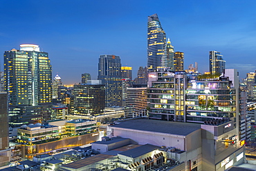 City skyline at dusk from hotel rooftop bar, Bangkok, Thailand, Southeast Asia, Asia