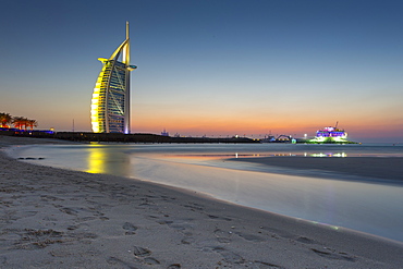 Burj Al Arab Hotel after sunset on Jumeirah Beach, Dubai, United Arab Emirates, Middle East