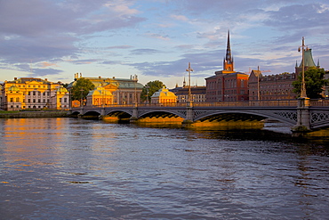 Gamla Stan and Riddarholmen with spire of Riddarholmskyrkan (Riddarholmen Church) on the skyline at sunset, Stockholm, Sweden, Scandinavia, Europe