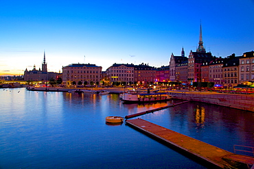 Gamla Stan and Riddarholmen with spire of Riddarholmskyrkan (Riddarholmen Church) at dusk, Stockholm, Sweden, Scandinavia, Europe