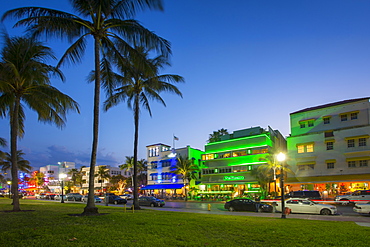 Ocean Drive restaurants and Art Deco architecture at dusk, South Beach, Miami Beach, Miami, Florida, United States of America, North America