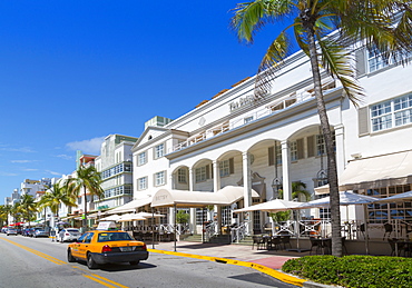 Ocean Drive and Art Deco architecture and yellow cab, Miami Beach, Miami, Florida, United States of America, North America