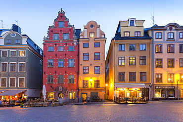 View of colourful buildings on Stortorget, Old Town Square in Gamla Stan at dusk, Stockholm, Sweden, Scandinavia, Europe