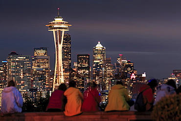 Seattle city skyline at night with illuminated office buildings and Space Needle viewed from public garden near Kerry Park, Seattle, Washington State, United States of America, North America