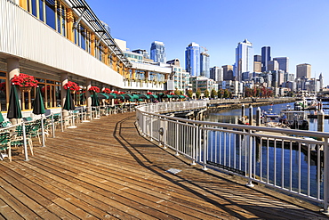 Seattle skyline and restaurants on sunny day in Bell Harbor Marina, Seattle, Washington State, United States of America, North America