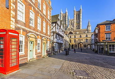 Lincoln Cathedral viewed from Exchequer Gate with red telephone visible, Lincoln, Lincolnshire, England, United Kingdom, Europe