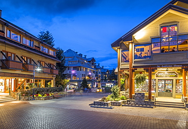 Illuminated bar on Village Stroll at dusk, Whistler, British Columbia, Canada, North America