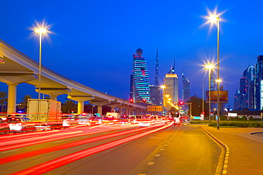 City skyline and car trail lights at sunset, Dubai, United Arab Emirates, Middle East