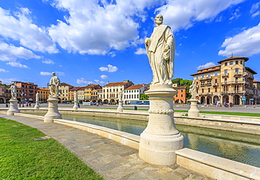 View of statues in Prato della Valle and colourful architecture  in the background, Padua, Veneto, Italy, Europe