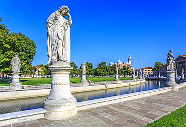 View of statues in Prato della Valle and Santa Giustina Basilica visible in background, Padua, Veneto, Italy, Europe