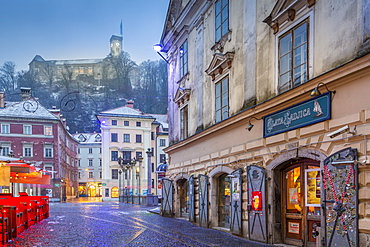 View from Old Town streets toward Ljubljana Castle at dusk, Ljubljana, Slovenia, Europe