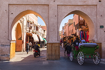 View of horse and carriage on the Route du Ourika and city gate visible in background, Marrakesh (Marrakech), Morocco, North Africa, Africa