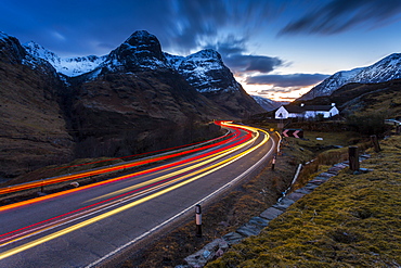 View of road through the Glencoe Valley at dusk, Glencoe, Highland Region, Scotland, United Kingdom, Europe