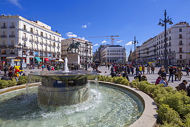 View of fountain and King Carlos lll statue in Puerta del Sol, Madrid, Spain, Europe