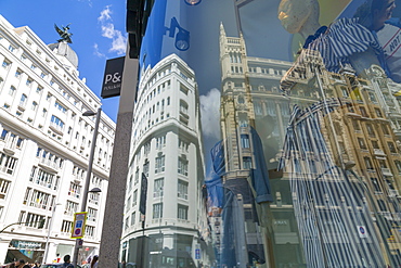 View of Buildings reflecting in designer shop window on Gran Via, Madrid, Spain, Europe