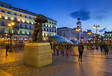 View of Bear and Strawberry Tree statue and Puerta Del Sol at dusk, Madrid, Spain, Europe